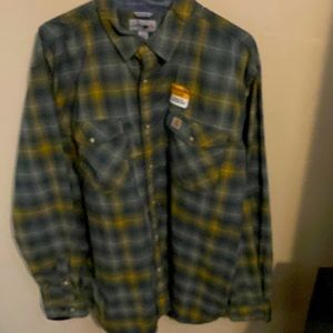 Carhartt “Rugged Flex” stretch technology with pearl button snaps. Size XL